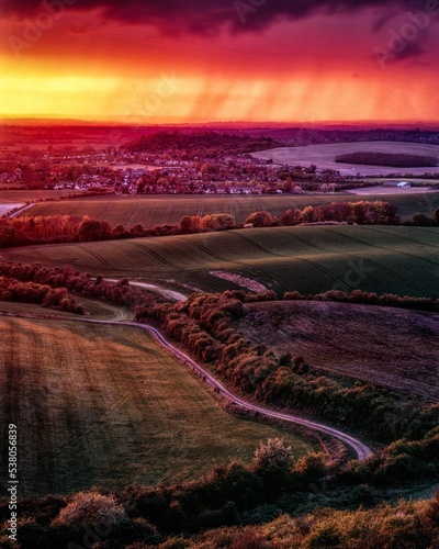 Aylesbury landscape view at sunset from the Dunstable Downs purple and red sky background, UK photo