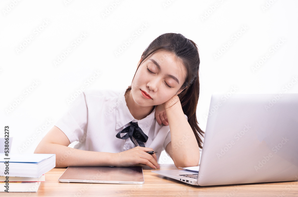 Asian female students taking an online class against a white background Asian female students taking an online class against a white background