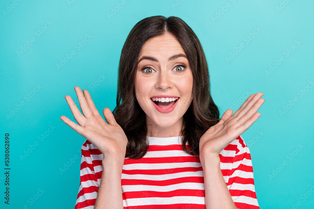 Close up photo of overjoyed pretty lady show palm celebrate success win victory wear stylish clothes isolated on cyan color background Close up photo of overjoyed pretty lady show palm celebrate success win victory wear stylish clothes isolated on cyan color background