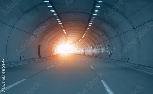 Abstract speed motion in blue highway road tunnel at sunset