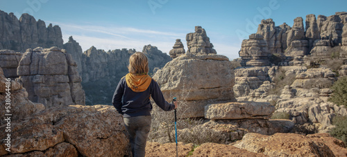 rear view of boy visiting Torcal- Spain photo