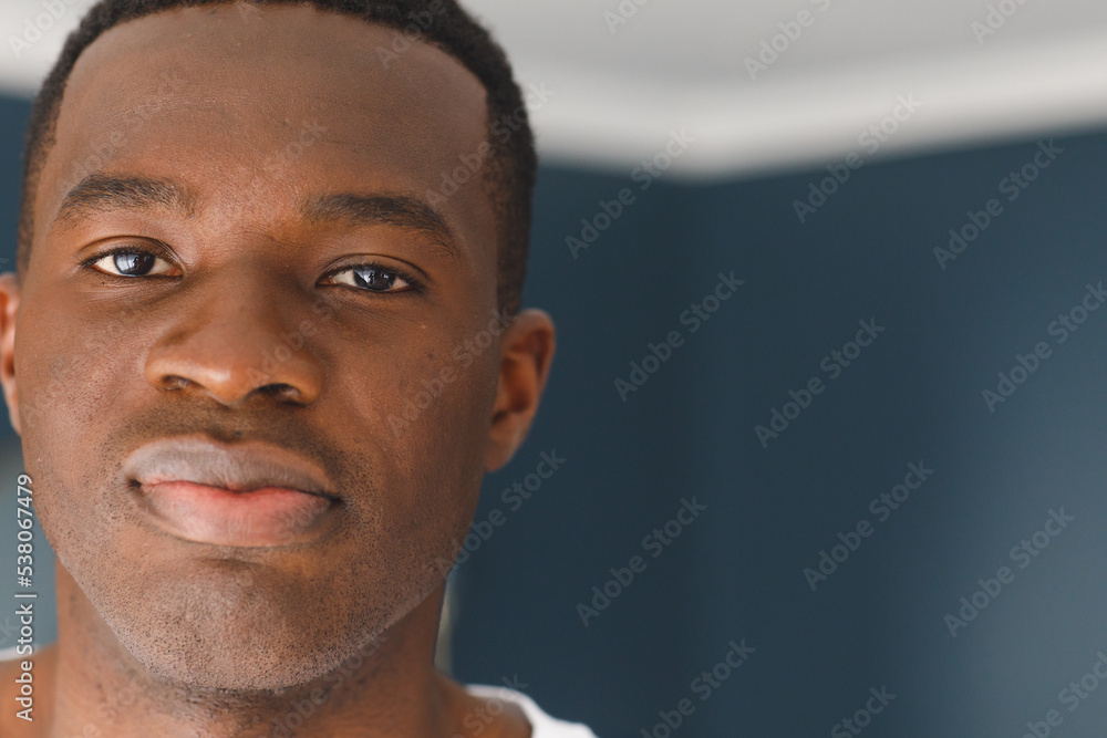Fototapeta premium Close up portrait of african american man looking straight to camera, with copy space
