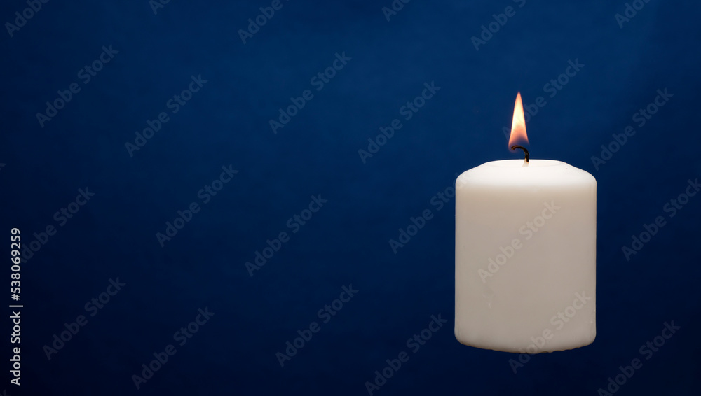 Wax candle with a blue dark back flame Wax candle with a blue dark back flame