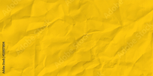 crumpled shiny yellow paper background.