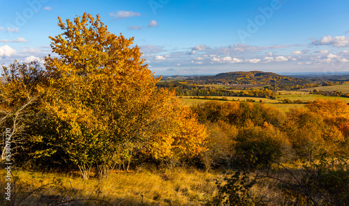 Colorful autumn landscape. Beautiful yellow trees. Fall on Ovčí vrch (Schaafberg) near Krasíkov in Tachov district, Pilsen region, Czech republic.