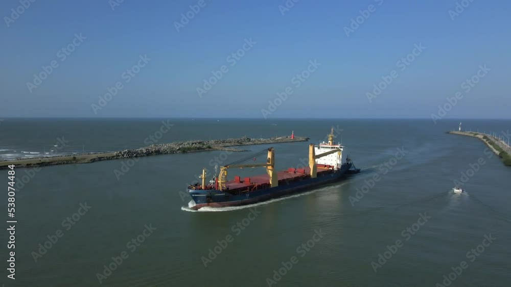 Aerial View of an Ocean Liner Vessel Entering the Seaport Harbor. Aerial View of an Ocean Liner Vessel Entering the Seaport Harbor.