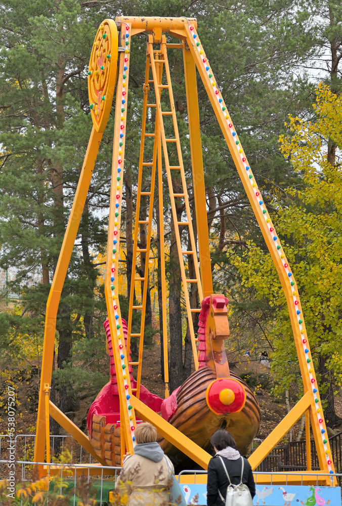 Fototapeta premium Fragment of an amusement park attraction on an autumn day