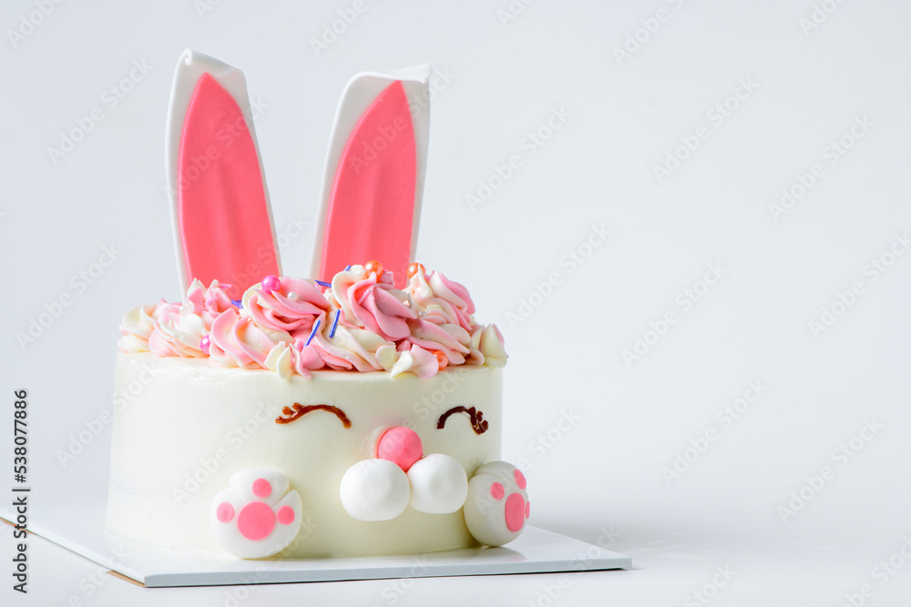 Easter bunny celebration cake on white background, homemade cute Easter bunny celebration cake on white background, homemade cute
