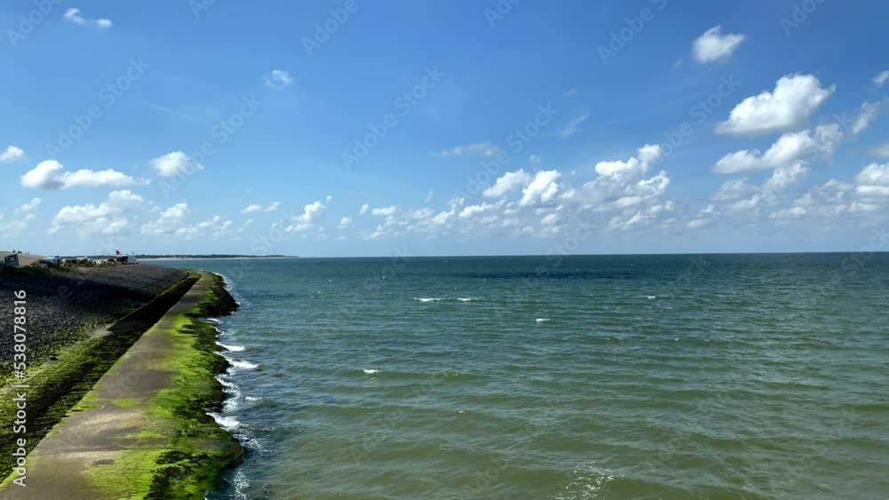 Shore line, beach and waves at the Dutch coast in 2022, The Netherlands. High quality 4k footage Shore line, beach and waves at the Dutch coast in 2022, The Netherlands. High quality 4k footage