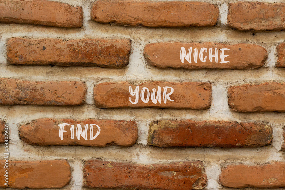 Find your niche symbol. Concept words Find your niche on red bricks on a beautiful brick wall background. Business and find your niche concept. Copy space. Find your niche symbol. Concept words Find your niche on red bricks on a beautiful brick wall background. Business and find your niche concept. Copy space.
