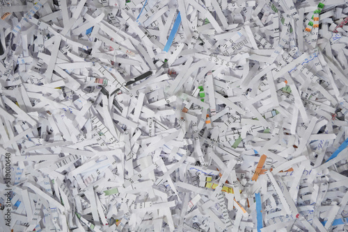 Heap of white shredded papers background.