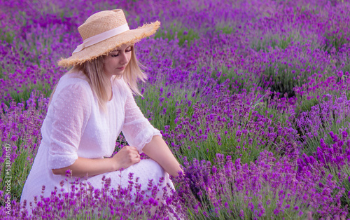 the girl is resting in the lavender field.