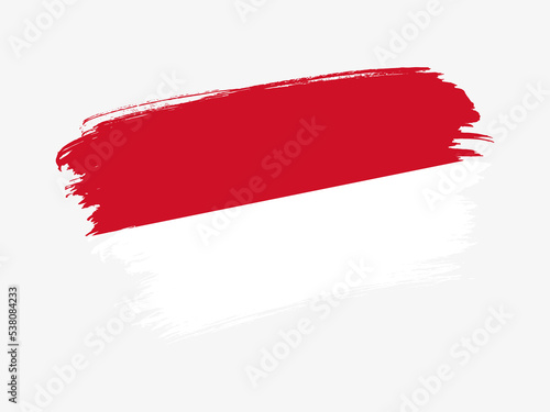 Monaco flag made in textured brush stroke. Patriotic country flag on white background