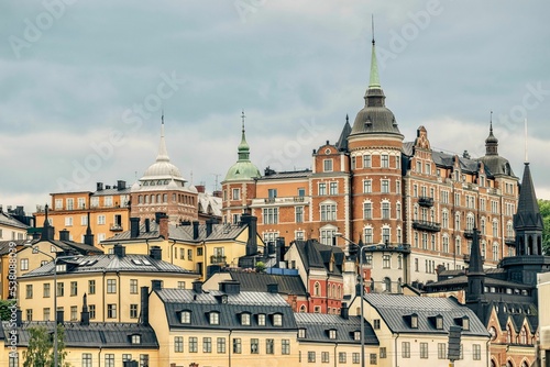 Photography Scenic shot of the Laurinska House over the black-roofed buildings in Sweden