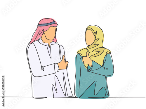 Fototapeta Naklejka Na Ścianę i Meble -  One continuous line drawing of young muslim male and female workers give thumbs up to celebrate job promotion. Islamic clothing hijab, scarf, keffiyeh. Single line draw design vector illustration