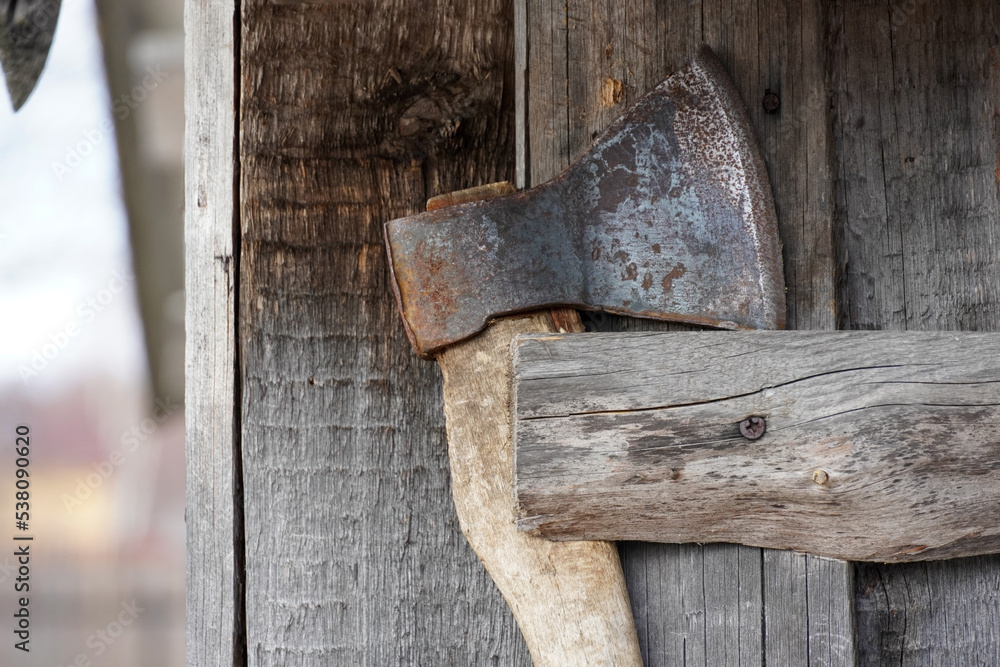 Old ax with wooden handle. High quality photo Old ax with wooden handle. High quality photo