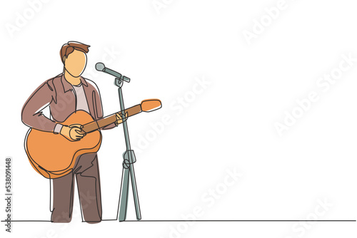 One continuous line drawing of young happy male guitarist playing acoustic guitar and singing on music festival stage. Musician artist performance concept single line draw design vector illustration
