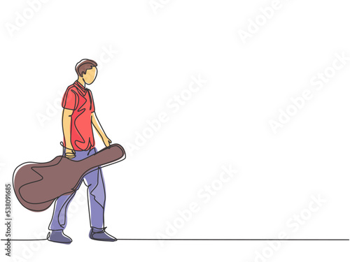 One single line drawing of young male guitarist walking while carrying acoustic guitar leather case on his hand. Musician artist performance concept continuous line draw design vector illustration