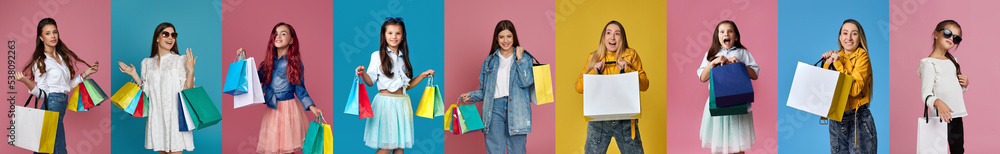excited smiling women and girls with shopping bags