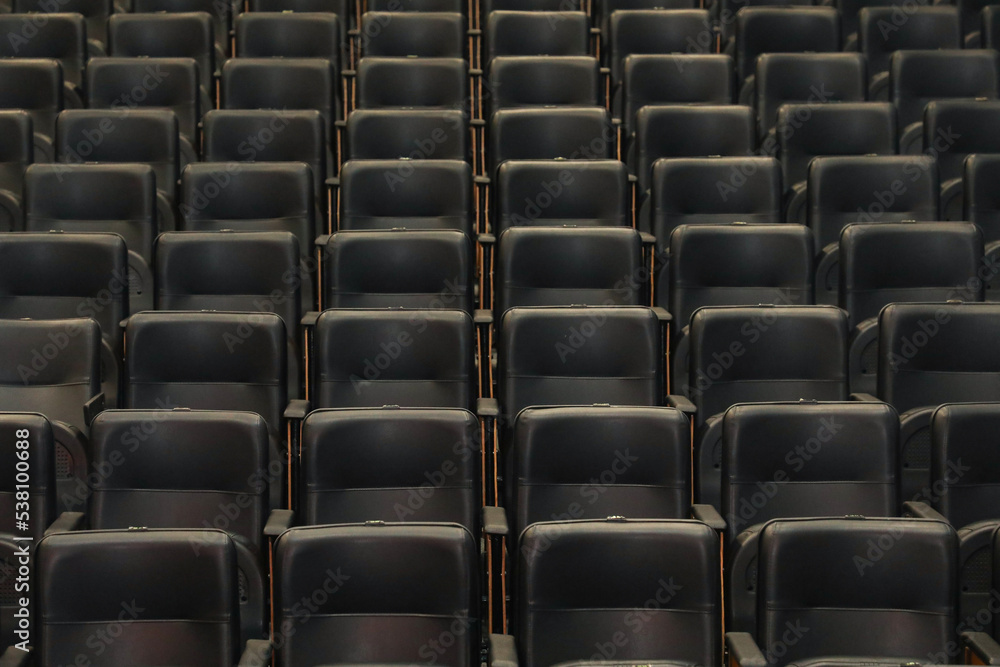 Theater auditorium with emphasis on the black chairs and wooden sides, all the same giving continuity and lines. Theater auditorium with emphasis on the black chairs and wooden sides, all the same giving continuity and lines.