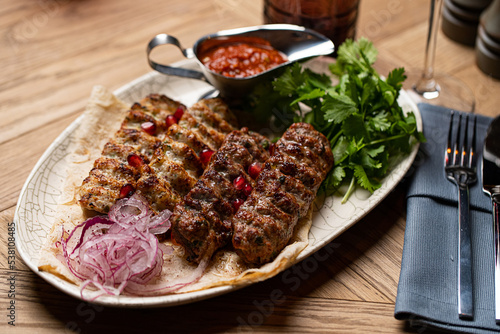 lula kebab on a plate in a restaurant