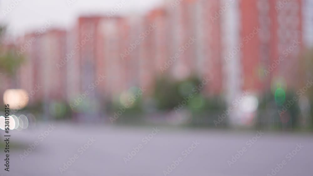 Blurred background. Cityscape bokeh. Defocused abstract city. Walking area in the city