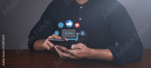 Businessman using smart phone, Social media and digital online concept. The concept of living on vacation and playing social media. Social Distancing ,Working From Home concept.