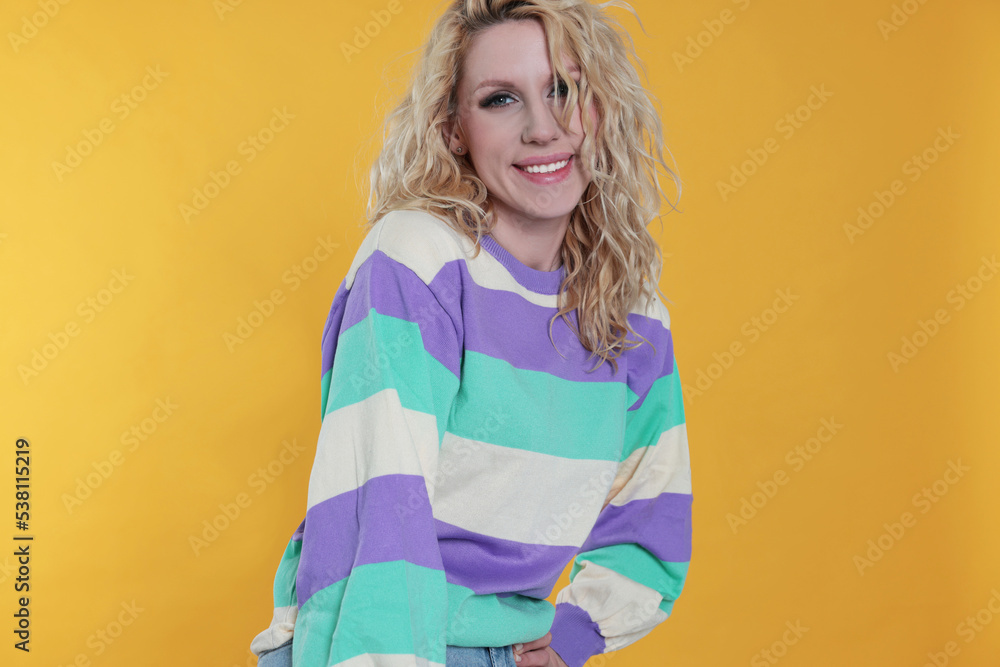 Portrait of beautiful young woman on orange background Portrait of beautiful young woman on orange background