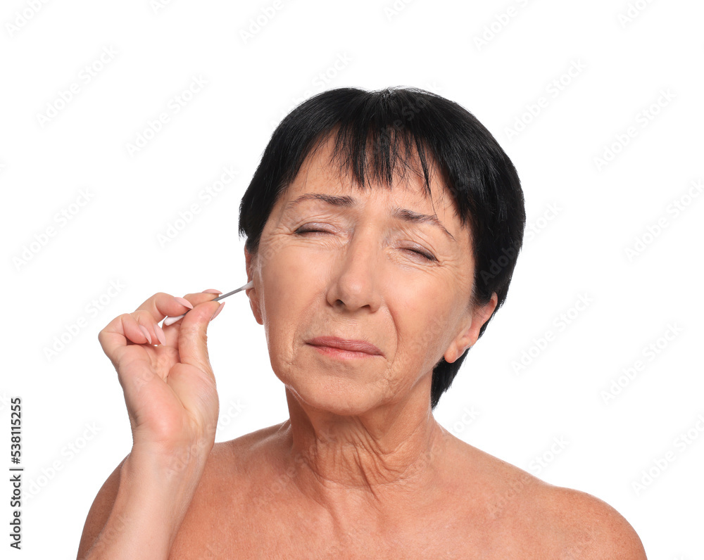 Senior woman cleaning ear with cotton swab on white background Senior woman cleaning ear with cotton swab on white background