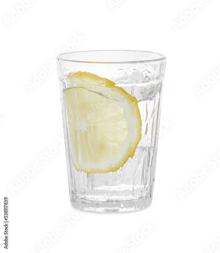 Water with sliced lemon splashing out of glass on white background