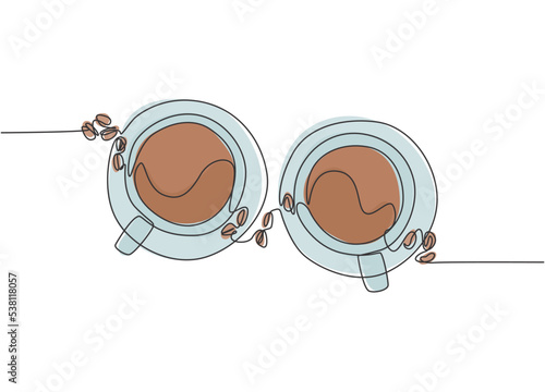 Single continuous line drawing of two cups of coffee with coffee beans and leaf from top view. Coffee drink concept display for coffee shop. One line draw design illustration