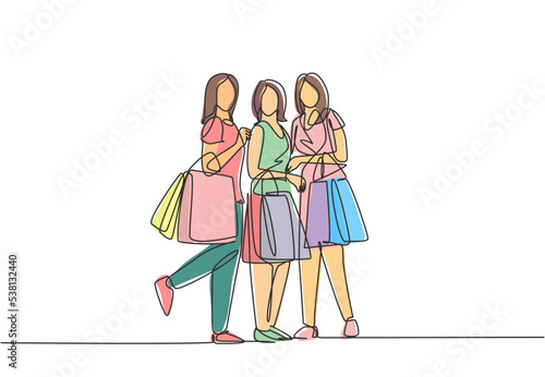 Single continuous line drawing group of beauty women holding paper bags while shopping together at mall. Business retail shopping concept. One line draw vector graphic design illustration