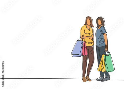 Single continuous line drawing two beauty happy women holding paper bags after shopping clothes, dress, make up, cosmetic at mall. Shopping concept. One line draw vector graphic design illustration