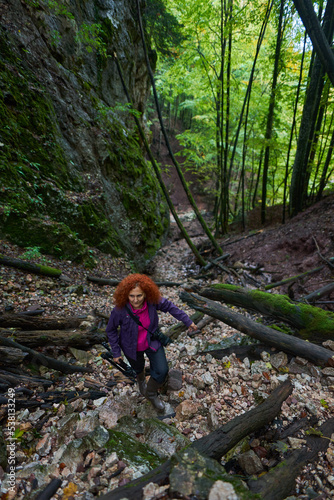 Nature photographer lady on a hiking trail