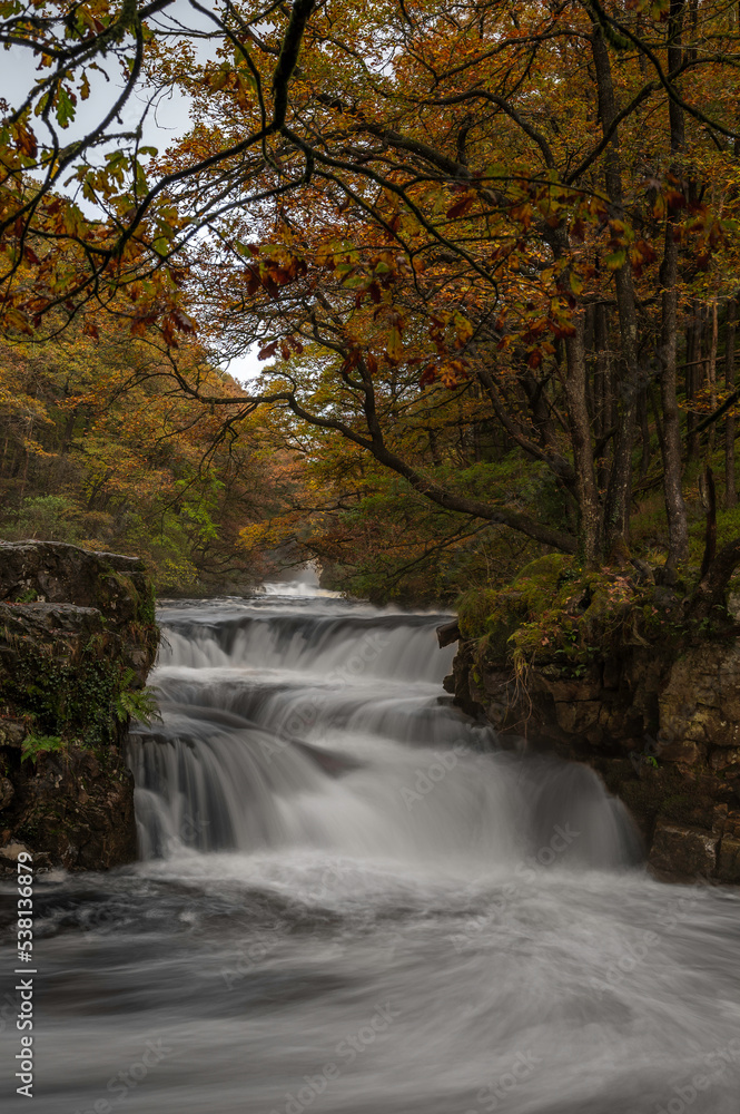 Autumnal waterfall along the Four Waterfalls walk, Waterfall Country, Brecon Beacons national park, South Wales, the United Kingdom