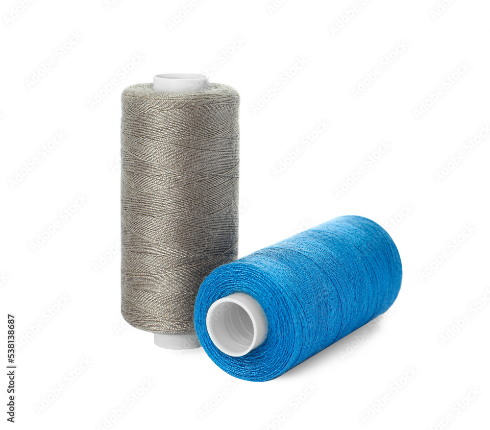 Different colorful sewing threads on white background