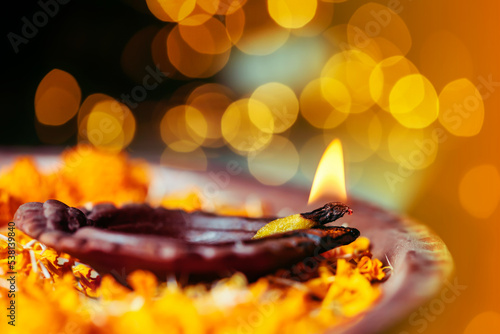 Diwali Diya, oil lamp beautifully decorated on the festive occasion of  deepawali. Beautiful stock photo with copy space of diwali diya for background concept. photo