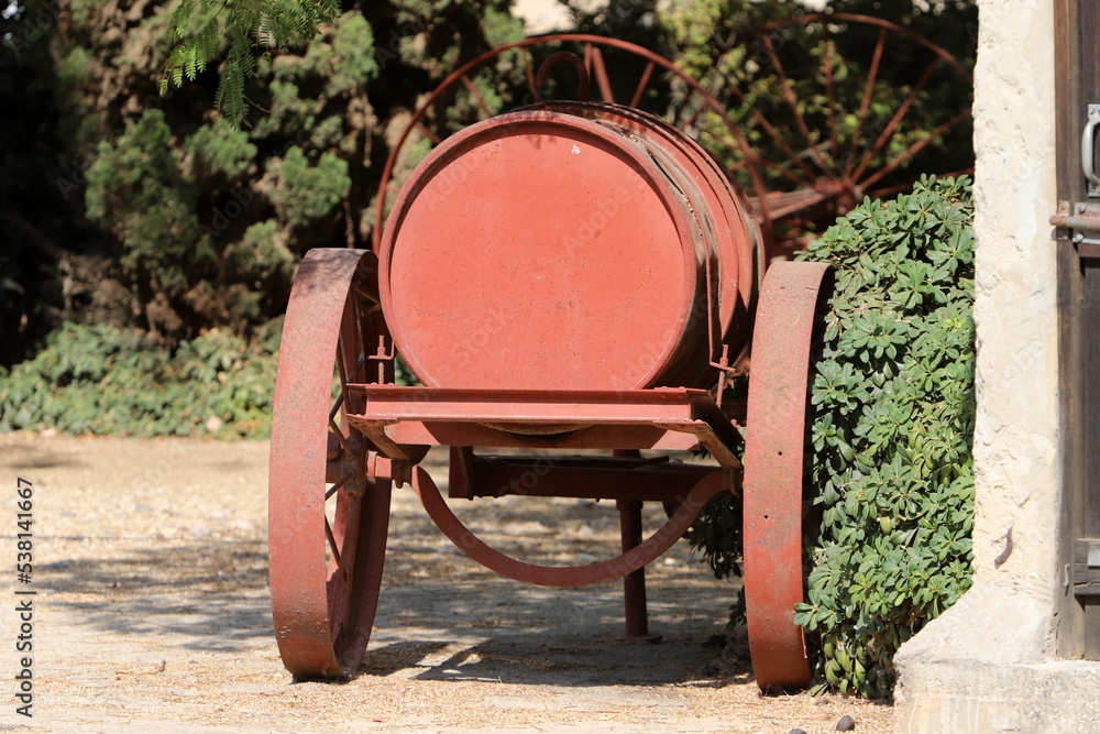 Old agricultural machinery stands on the street in Israel and rusts