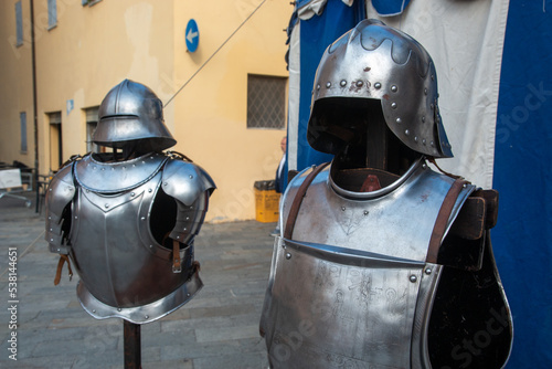 Historical re-enactments medieval weapons and armor appearing in medieval clothes photo