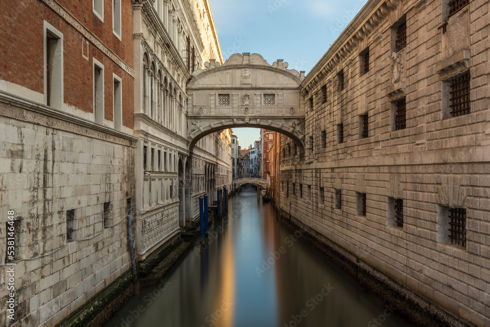 Bridge of Sighs and Doge's Palace in Venice, Italy. Long exposure to smooth out the water