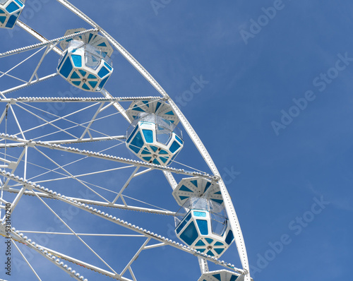 Carnival Ferris Wheel against blue-sky background 