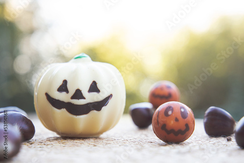 Halloween chocolate candies, white chocolate pumpkins and chestnuts.
