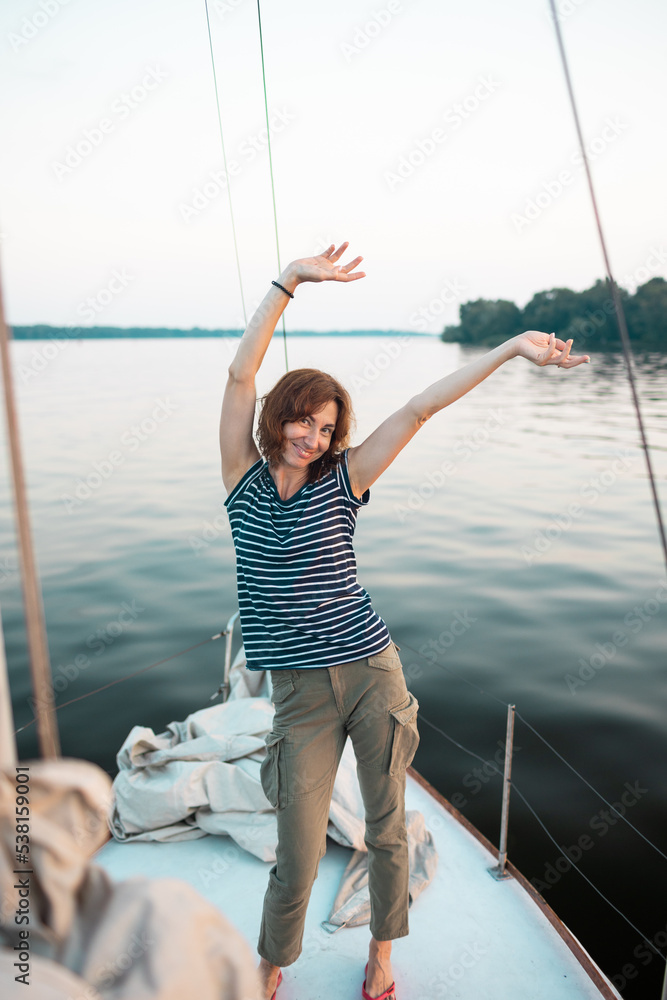 Young woman having fun on a yacht Young woman having fun on a yacht