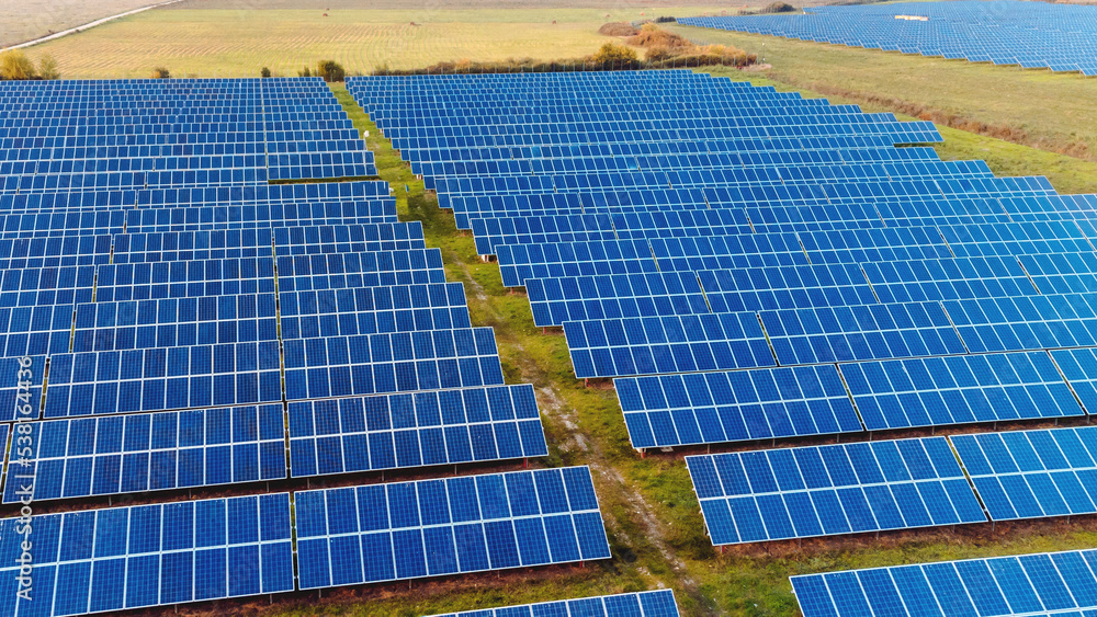 Fototapeta premium photovoltaic power plant. sunset and solar panel, photovoltaic, alternative electricity source