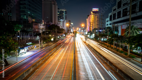 The light of cars running against each other with a low shutter shot in the middle of the capital Bangkok Thailand