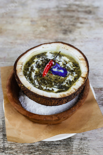 Famous Laing food served in a dish isolated on grey background side view of stewed photo