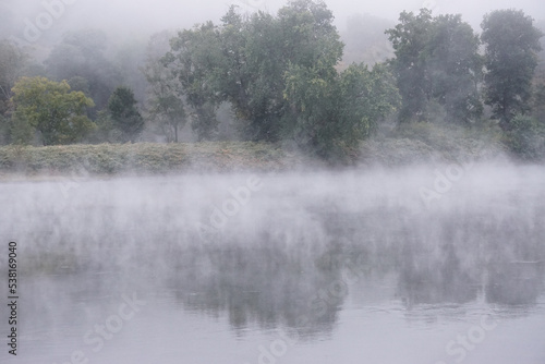 Shawnee on Delaware, Pennsylvania, USA: Early morning mist rising from waters of the Delaware River, in the Delaware Water Gap. © Linda Harms