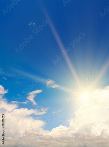 Photography Blue summer sky with fluffy clouds and bright sun as a background