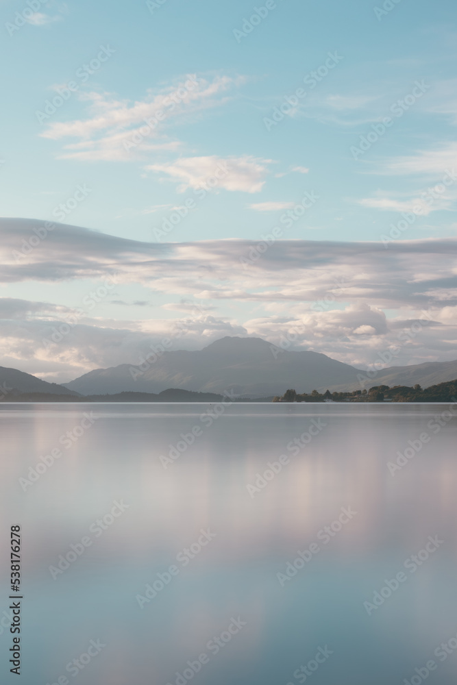 Beautiful daytime reflections on Loch Lomond of Ben Lomond