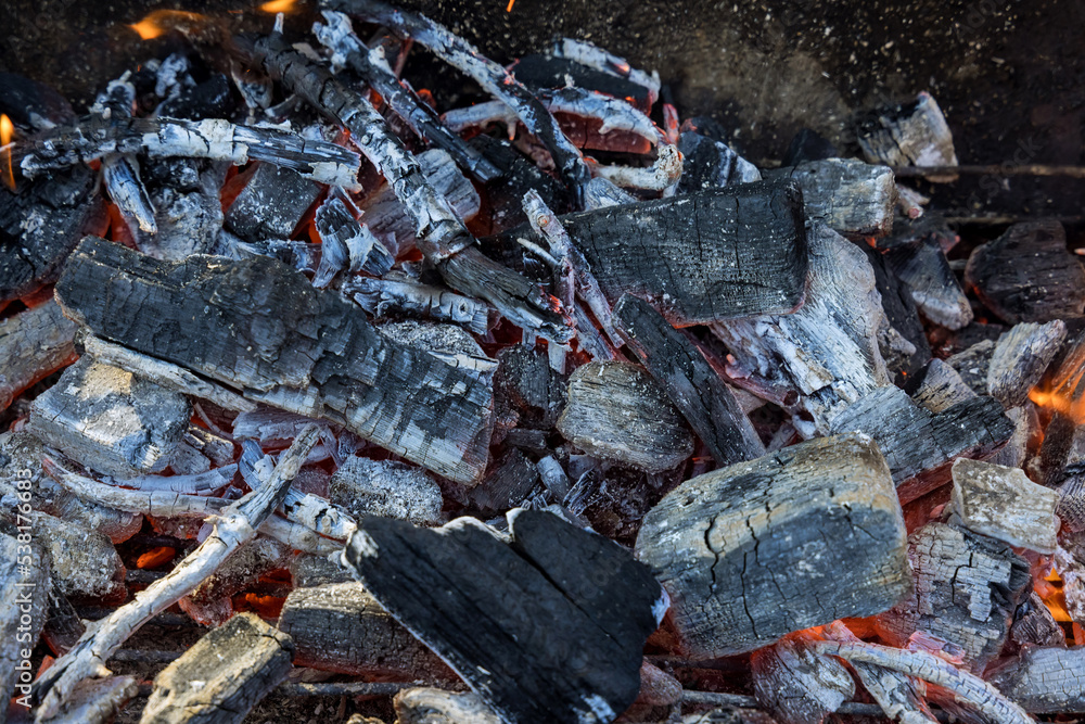 The preparation of fire for a BBQ to by burning charcoal logs the grill with cooking The preparation of fire for a BBQ to by burning charcoal logs the grill with cooking